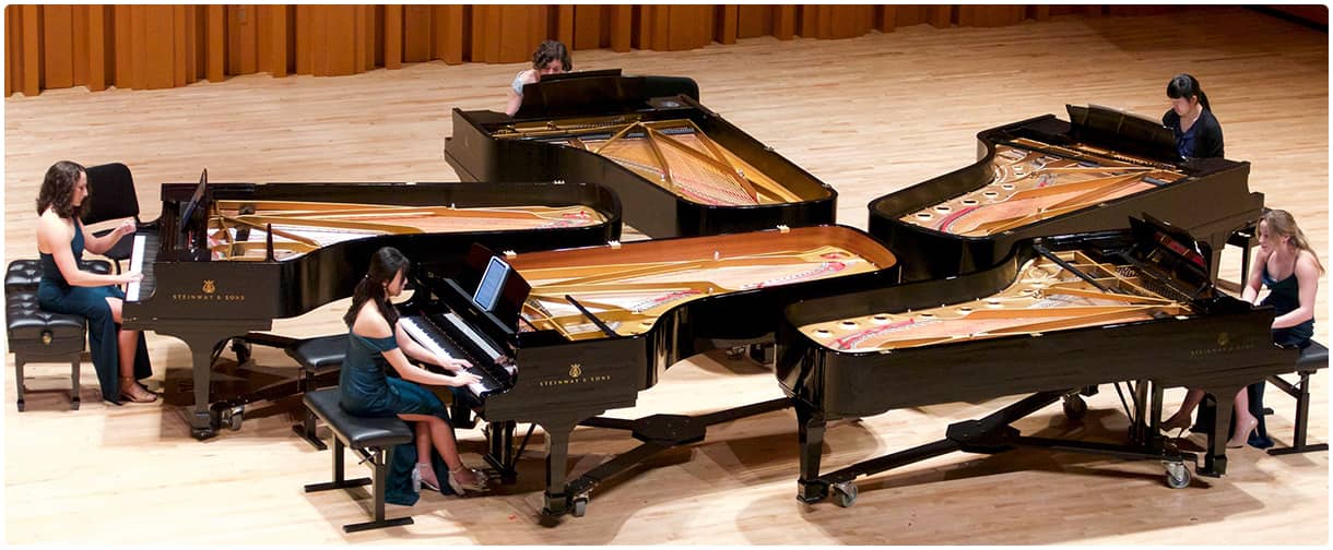 Steinway pianos on stage: UGA&nbsp;All-Steinway University.